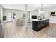Bright living room with a modern kitchen island, an open layout, and contemporary furniture at 3139 Alston Dr, Decatur, GA 30032