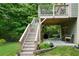 Multi-tiered deck and patio overlooking a lush backyard with mature trees at 33 Kay Ne Rd, White, GA 30184