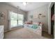 Cozy ' bedroom with soft carpet, bright decor, and a daybed with storage at 33 Kay Ne Rd, White, GA 30184