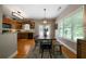 Open concept dining area featuring hardwood floors, modern lighting, and access to an outdoor space at 33 Kay Ne Rd, White, GA 30184