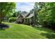Beautifully landscaped front yard with a well-maintained lawn, shrubs and a charming facade at 33 Kay Ne Rd, White, GA 30184