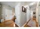 Bright hallway with hardwood floors, white trim, and access to various rooms in the home at 33 Kay Ne Rd, White, GA 30184