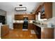 Traditional-style kitchen with granite countertops, stainless steel appliances, and wood cabinets at 33 Kay Ne Rd, White, GA 30184