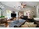 Open living room with high ceilings, stone fireplace, hardwood flooring, and comfortable furnishings at 33 Kay Ne Rd, White, GA 30184