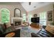 Living room with stone fireplace and hearth, vaulted ceilings and hardwood flooring at 33 Kay Ne Rd, White, GA 30184