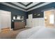 Spacious bedroom with blue walls, tray ceiling, and view to the bathroom at 33 Kay Ne Rd, White, GA 30184