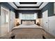Stylish main bedroom with tray ceiling, ensuite bath access, and soft, neutral decor at 33 Kay Ne Rd, White, GA 30184