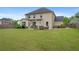 A spacious lawn and outdoor seating area highlight this backyard at 800 Ivy Crest Ln, Canton, GA 30115