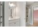 Bright bathroom featuring a vanity and bathtub-shower combination at 800 Ivy Crest Ln, Canton, GA 30115
