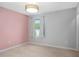 Carpeted bedroom with light fixture and view to the outside at 800 Ivy Crest Ln, Canton, GA 30115