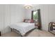 Comfortable bedroom with neutral colors, stylish lighting, and bright window view at 800 Ivy Crest Ln, Canton, GA 30115