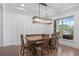 Dining room with a rustic table, bench, and view to the neighborhood at 800 Ivy Crest Ln, Canton, GA 30115