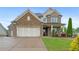 This stunning two-story home features a stone facade and two-car garage at 800 Ivy Crest Ln, Canton, GA 30115
