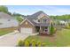 This stunning two-story home features a stone facade and a well-manicured lawn at 800 Ivy Crest Ln, Canton, GA 30115