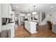 Spacious open kitchen featuring a central island, stainless appliances, and hardwood floors at 800 Ivy Crest Ln, Canton, GA 30115