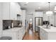 Bright kitchen with stainless steel appliances, white cabinets, and hardwood floors at 800 Ivy Crest Ln, Canton, GA 30115