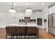 Stylish kitchen with an island, pendant lights, stainless appliances, and ample storage at 800 Ivy Crest Ln, Canton, GA 30115