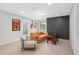Cozy living room with comfortable seating, a wood accent wall, and natural light at 800 Ivy Crest Ln, Canton, GA 30115