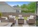 Covered outdoor patio with comfortable seating and a fire pit for relaxing at 800 Ivy Crest Ln, Canton, GA 30115