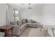 Comfortable sitting room with carpet, shiplap, gray couch, and lots of natural light at 800 Ivy Crest Ln, Canton, GA 30115