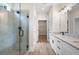 Elegant bathroom featuring a glass shower, granite countertops, and modern fixtures at 130 Doris Path, Dallas, GA 30157