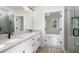 Elegant bathroom featuring a glass shower, granite countertops, and double sinks at 130 Doris Path, Dallas, GA 30157