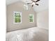 Bright bedroom with large windows offering natural light and views of the outdoors at 130 Doris Path, Dallas, GA 30157