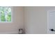 Bedroom features a large window overlooking wooded area at 130 Doris Path, Dallas, GA 30157