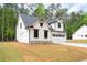 New construction shows off the two-story home with board and batten siding and a two-car garage at 130 Doris Path, Dallas, GA 30157