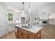 Open kitchen showcases granite countertops, an island, and seamless flow to the living area at 130 Doris Path, Dallas, GA 30157