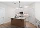 Kitchen offers stainless steel appliances, granite countertops, a central island, and ample storage at 130 Doris Path, Dallas, GA 30157