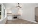 Bright living room with a stone fireplace, built-in shelving, and large windows allowing ample natural light at 130 Doris Path, Dallas, GA 30157