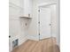 Bright laundry room with white cabinets at 130 Doris Path, Dallas, GA 30157