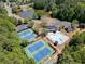Aerial view of community amenities, including a pool, clubhouse, and tennis courts at 2436 Camden Lake Nw Vw, Acworth, GA 30101
