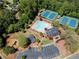 Aerial view of the community clubhouse, pool, and tennis courts at 2436 Camden Lake Nw Vw, Acworth, GA 30101