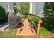 Picturesque backyard walkway leading to the lake, surrounded by lush greenery and landscaping at 2436 Camden Lake Nw Vw, Acworth, GA 30101