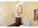 Powder room with wood vanity and neutral finishes at 2436 Camden Lake Nw Vw, Acworth, GA 30101