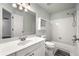 Bathroom featuring a single vanity, tile flooring, shower-tub combo, and large mirror at 2436 Camden Lake Nw Vw, Acworth, GA 30101