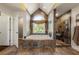 Bathroom featuring a shower, bathtub, tile flooring, and natural light at 2436 Camden Lake Nw Vw, Acworth, GA 30101