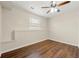 Neutral bedroom with wood floors and a window, offering a serene and relaxing space at 2436 Camden Lake Nw Vw, Acworth, GA 30101