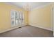 Bright bedroom featuring plush carpet and shuttered window at 2436 Camden Lake Nw Vw, Acworth, GA 30101
