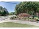 Brick Camden Pointe community sign nestled amongst mature trees at 2436 Camden Lake Nw Vw, Acworth, GA 30101