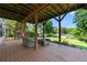 Outdoor deck space featuring comfortable seating and serene views of the lake and lush backyard at 2436 Camden Lake Nw Vw, Acworth, GA 30101
