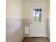 Interior view of a white door with glass inserts, offering natural light and a view of the outdoors at 2436 Camden Lake Nw Vw, Acworth, GA 30101
