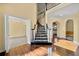 Bright foyer showcasing staircase and hardwood floors at 2436 Camden Lake Nw Vw, Acworth, GA 30101