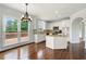 Eat-in kitchen with granite countertops, stainless appliances, breakfast bar, and hardwood floors at 2436 Camden Lake Nw Vw, Acworth, GA 30101