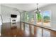 Bright living room featuring hardwood floors, fireplace, tall ceilings, and access to a deck at 2436 Camden Lake Nw Vw, Acworth, GA 30101