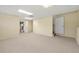 Large open living room with neutral carpet and paint, providing a blank canvas for personalization at 2436 Camden Lake Nw Vw, Acworth, GA 30101