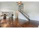 Spacious living room with hardwood floors, open floor plan, stairs, and view of the kitchen at 2436 Camden Lake Nw Vw, Acworth, GA 30101