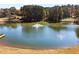 Scenic community pond with fountain and surrounding trees at 2436 Camden Lake Nw Vw, Acworth, GA 30101